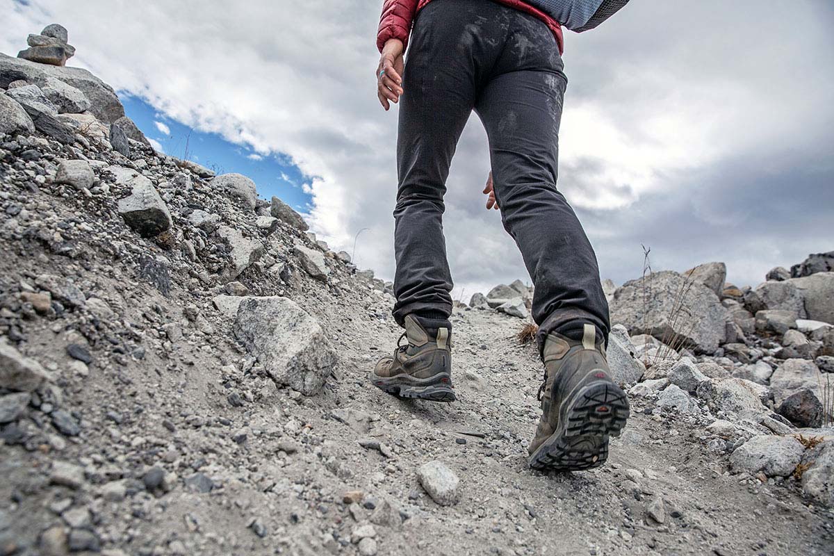 Hiking up trail in the mountains (women's hiking boots)